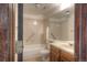 Bathroom featuring tub, toilet, vanity with wood cabinets at 11884 Elk Head Range Rd, Littleton, CO 80127