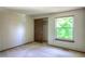 Bedroom featuring neutral carpet and window with lots of natural light at 11884 Elk Head Range Rd, Littleton, CO 80127