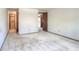 Carpeted bedroom provides access to closet and hallway, a comfortable and blank space at 11884 Elk Head Range Rd, Littleton, CO 80127