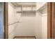 Functional closet featuring shelving and hanging rods, providing efficient storage solutions at 11884 Elk Head Range Rd, Littleton, CO 80127