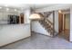 Open dining area showcasing a staircase and a partial view of the kitchen, offering a great flow for entertaining at 11884 Elk Head Range Rd, Littleton, CO 80127