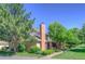 View of the townhouse exterior with well-maintained landscaping and architectural details at 11884 Elk Head Range Rd, Littleton, CO 80127