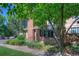Charming brick townhome featuring well-manicured landscaping and mature trees at 11884 Elk Head Range Rd, Littleton, CO 80127