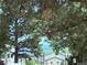 Neighborhood street view featuring mature landscaping with mountain views at 11884 Elk Head Range Rd, Littleton, CO 80127
