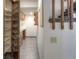 Hallway featuring a pantry and custom shelving at 11884 Elk Head Range Rd, Littleton, CO 80127