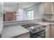 A clean kitchen design featuring modern appliances and neutral countertops at 11884 Elk Head Range Rd, Littleton, CO 80127