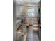 A bright kitchen with gray tile flooring and neutral cabinets at 11884 Elk Head Range Rd, Littleton, CO 80127