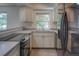 Well-lit kitchen featuring modern appliances, a double sink, and sleek countertops, making meal preparation a breeze at 11884 Elk Head Range Rd, Littleton, CO 80127