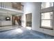 Open-concept living area featuring high ceilings, staircase to loft, and large windows, creating a bright and airy living space at 11884 Elk Head Range Rd, Littleton, CO 80127