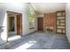 Bright living room with vaulted ceiling, brick fireplace, and large windows offering ample natural light and a cozy atmosphere at 11884 Elk Head Range Rd, Littleton, CO 80127