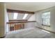 A cozy loft with exposed beams and skylights at 11884 Elk Head Range Rd, Littleton, CO 80127