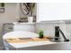 Elegant bathroom showcasing a modern tub with black fixtures and a stylish bath caddy at 27250 E Nova Cir, Aurora, CO 80016