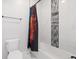 Bathroom featuring a tub with a shower and a decorative niche at 27250 E Nova Cir, Aurora, CO 80016