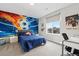 Vibrant bedroom with a unique soccer-themed wall mural and cozy decor at 27250 E Nova Cir, Aurora, CO 80016