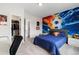 Another view of soccer-themed bedroom, showing the closet and ample space at 27250 E Nova Cir, Aurora, CO 80016