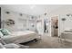 Bright bedroom featuring floral decals, plush bedding, and a walk-in closet access at 27250 E Nova Cir, Aurora, CO 80016