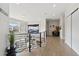 Stylish upper-level hallway with hardwood floors, modern lighting, and sleek railings at 27250 E Nova Cir, Aurora, CO 80016