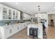 Modern kitchen featuring white cabinetry, an island with seating, and stainless steel appliances at 27250 E Nova Cir, Aurora, CO 80016