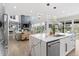 Open concept kitchen featuring a large island and view to the living room at 27250 E Nova Cir, Aurora, CO 80016