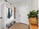 Functional mudroom with storage cubbies, bench, and coat hooks at 27250 E Nova Cir, Aurora, CO 80016