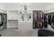 Spacious walk-in closet with custom shelving and ample storage space for clothing and accessories at 27250 E Nova Cir, Aurora, CO 80016
