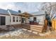 Charming backyard deck with pergola, offers a cozy outdoor dining space at 1190 Glencoe St, Denver, CO 80220