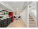 Functional basement area with kitchenette, dining area, and access to stairs, perfect for guests at 1190 Glencoe St, Denver, CO 80220