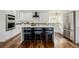 Contemporary eat-in kitchen with stainless steel appliances and an island at 1190 Glencoe St, Denver, CO 80220