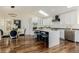 Modern eat-in kitchen with an island and stainless steel appliances at 1190 Glencoe St, Denver, CO 80220