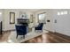 Stylish living room features a black fireplace, hardwood floors, and large window at 1190 Glencoe St, Denver, CO 80220
