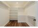 Well-organized walk-in closet with custom shelving and hardwood floors, providing ample storage space at 1190 Glencoe St, Denver, CO 80220