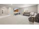 Finished basement with carpet, large sectional, and flat screen television at 2766 Keepsake Way, Castle Rock, CO 80109