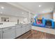 Finished basement bar area with grey cabinetry, white countertops, and a colorful bounce house at 2766 Keepsake Way, Castle Rock, CO 80109