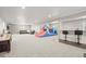 Expansive basement featuring a bar, play area, and comfortable seating arrangement at 2766 Keepsake Way, Castle Rock, CO 80109