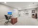 Finished basement office space with neutral carpet, desk, and doors leading to basement bar area at 2766 Keepsake Way, Castle Rock, CO 80109