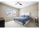 Bedroom with a ceiling fan, plush carpeting, and a large window for ample natural light at 2766 Keepsake Way, Castle Rock, CO 80109