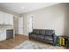 Versatile living space with vinyl floors, a kitchenette, ample natural light, and backyard access, ideal for entertaining at 2766 Keepsake Way, Castle Rock, CO 80109