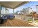 Spacious wood deck with outdoor seating, offering views of adjacent homes at 2766 Keepsake Way, Castle Rock, CO 80109