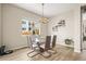 Bright dining room with sleek furniture and an abundance of natural light at 2766 Keepsake Way, Castle Rock, CO 80109