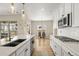 Bright kitchen view with a large island open to the dining area and stainless steel appliances at 2766 Keepsake Way, Castle Rock, CO 80109