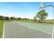 Community basketball court with green and gray surface, hoop, and nearby shade tree at 2169 Eagle Ave # 2169, Superior, CO 80027