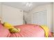 Cozy bedroom includes a large closet with bi-fold doors and comfortable furnishings at 2169 Eagle Ave # 2169, Superior, CO 80027