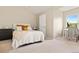 Bedroom with neutral decor, cozy bed, and a bright window with desk at 2169 Eagle Ave # 2169, Superior, CO 80027