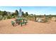 Community garden with picnic table, plots for planting, and gardening tools at 2169 Eagle Ave # 2169, Superior, CO 80027