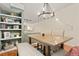 Dining room showcases built-in shelving and a chandelier over the table at 2169 Eagle Ave # 2169, Superior, CO 80027