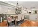 Dining room includes a wooden table, upholstered chairs, and adjacent kitchen area at 2169 Eagle Ave # 2169, Superior, CO 80027