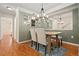Dining room featuring a wooden table with upholstered chairs and a stylish chandelier at 2169 Eagle Ave # 2169, Superior, CO 80027