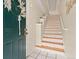 Charming entryway featuring a green front door, decorative wreath, and patterned stair risers for a stylish welcome at 2169 Eagle Ave # 2169, Superior, CO 80027
