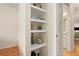 Hallway featuring decorative shelving and a view into the bathroom at 2169 Eagle Ave # 2169, Superior, CO 80027