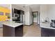 Modern kitchen equipped with stainless steel appliances, granite countertops, and dark cabinetry at 2169 Eagle Ave # 2169, Superior, CO 80027
